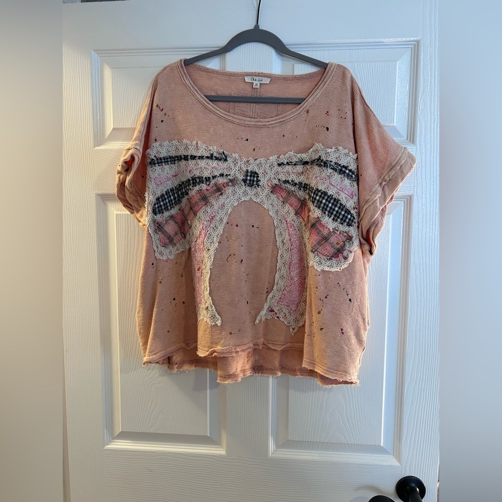 Oli & Hali Pink Paint Splatter Top with a Lacy Bow
